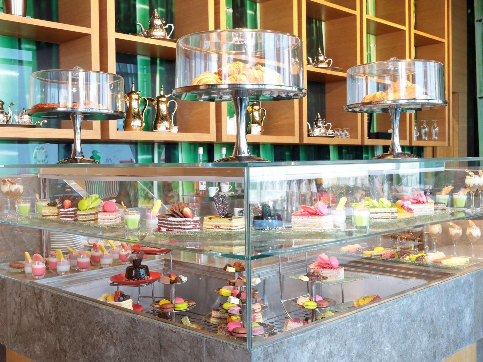 Novotel Jazan Exterior photo A display case of petit fours